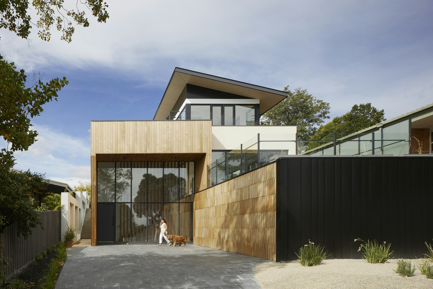 Contemporary residence with timber and dark cladding